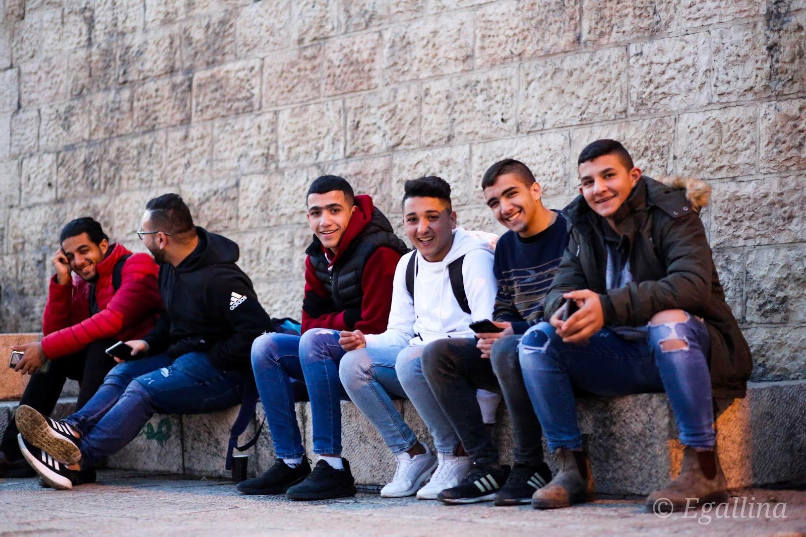 Photo of teens sitting down in Jerusalem