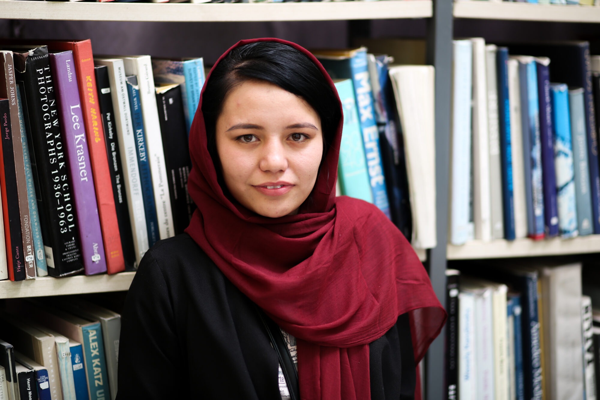 Photo of an Afghani woman in a dark red hijab