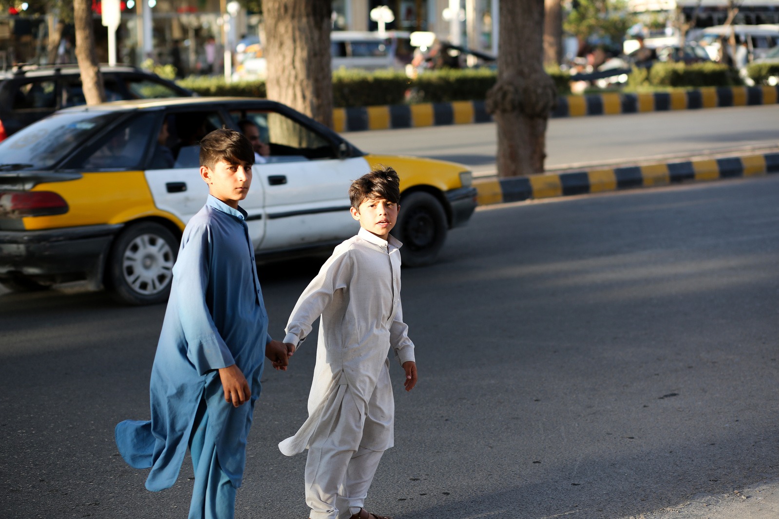 Photo of children crossing the street in Herat