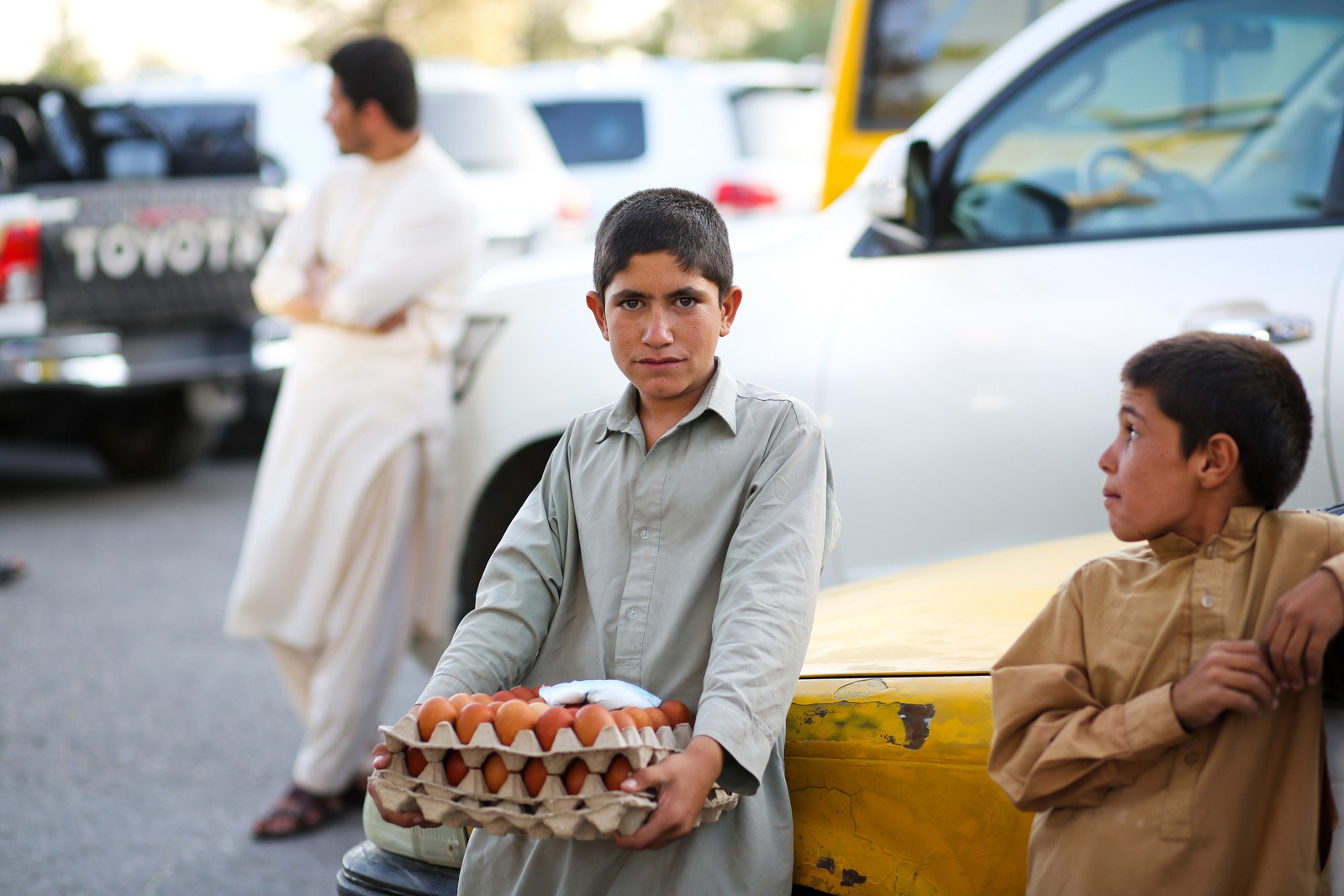 Photo of a teenager at a market in Herat