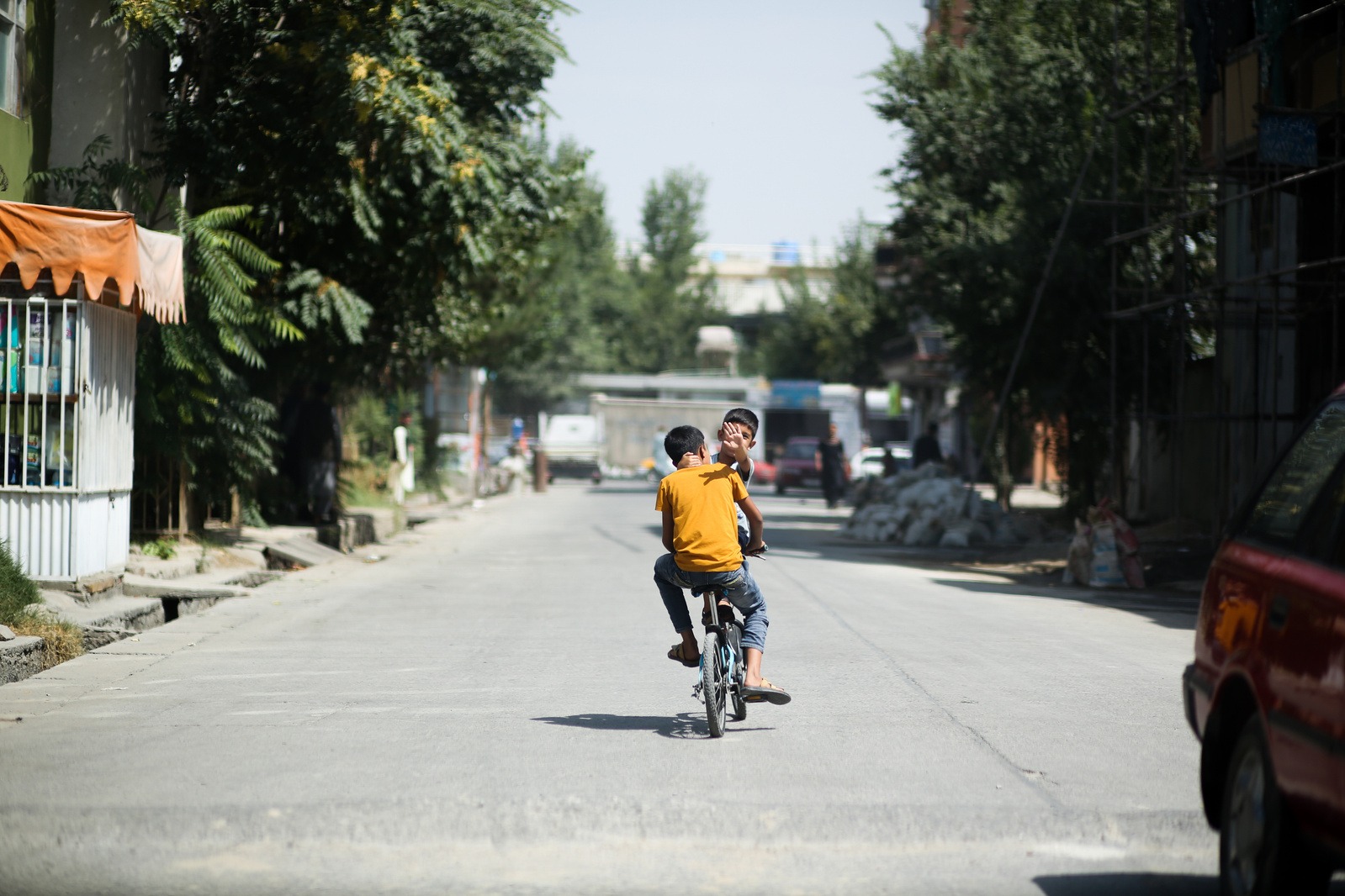 Photo of child on bike in Kabul
