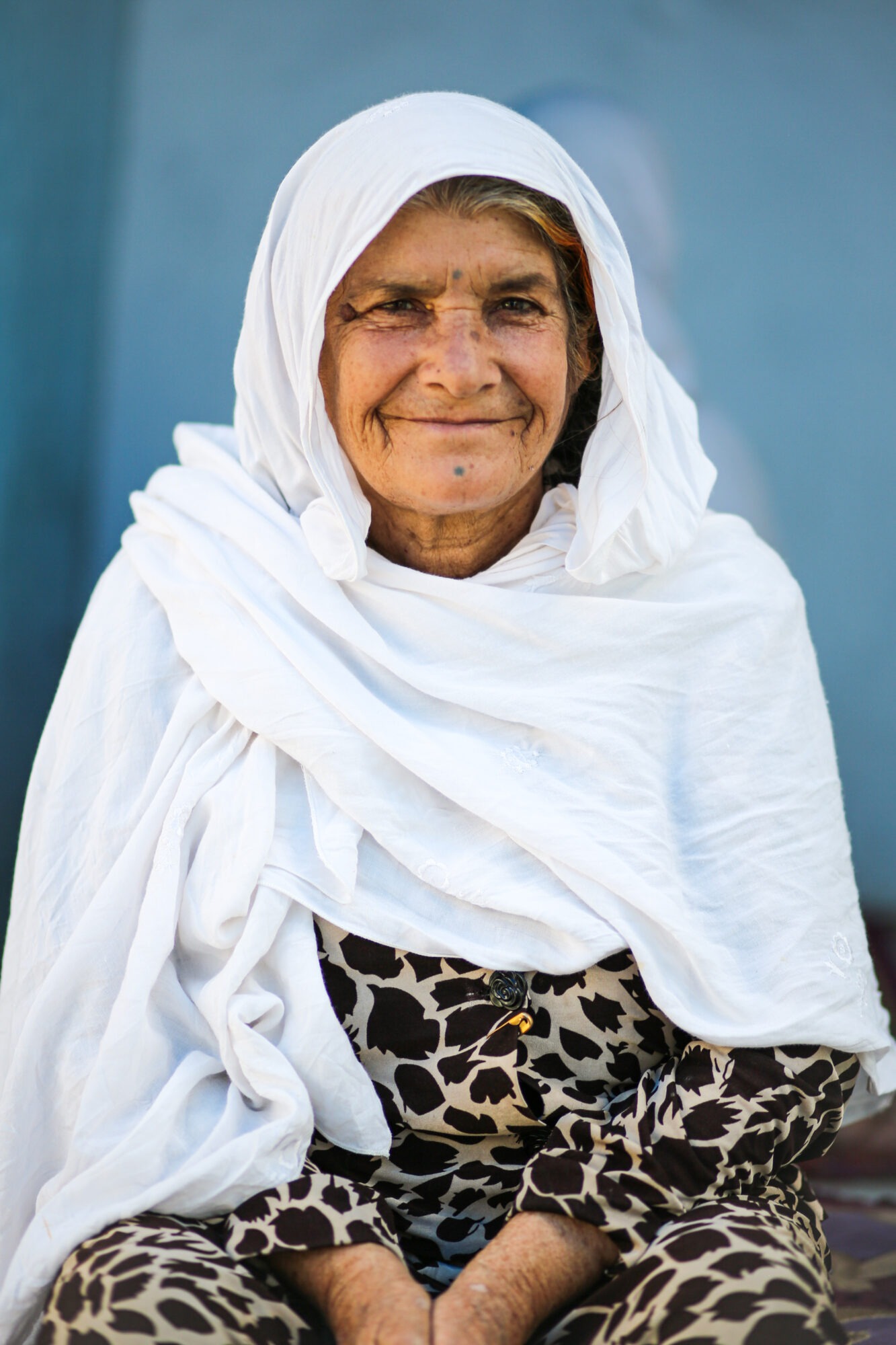Photo of an Afghani woman in a white hijab