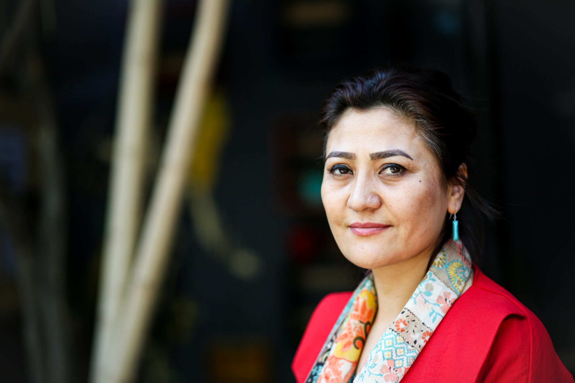 Photo of an Afghani woman in a red top