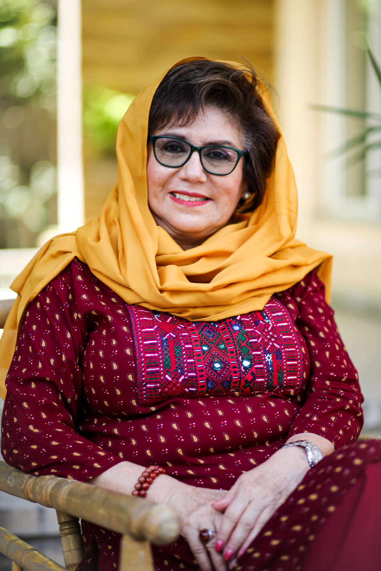 Photo of an Afghani woman in a gold hijab