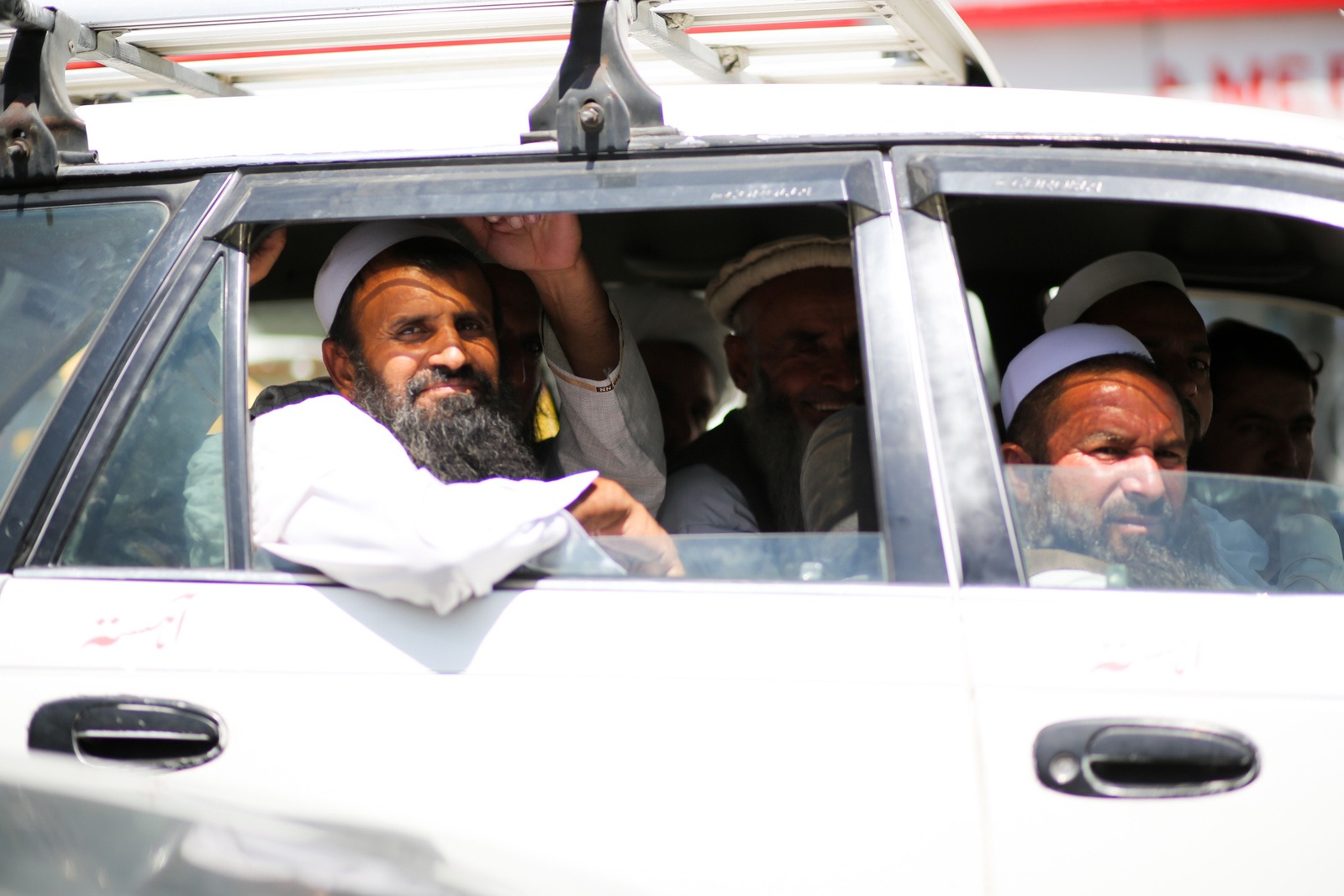 Photo of a man in a white car in Kabul
