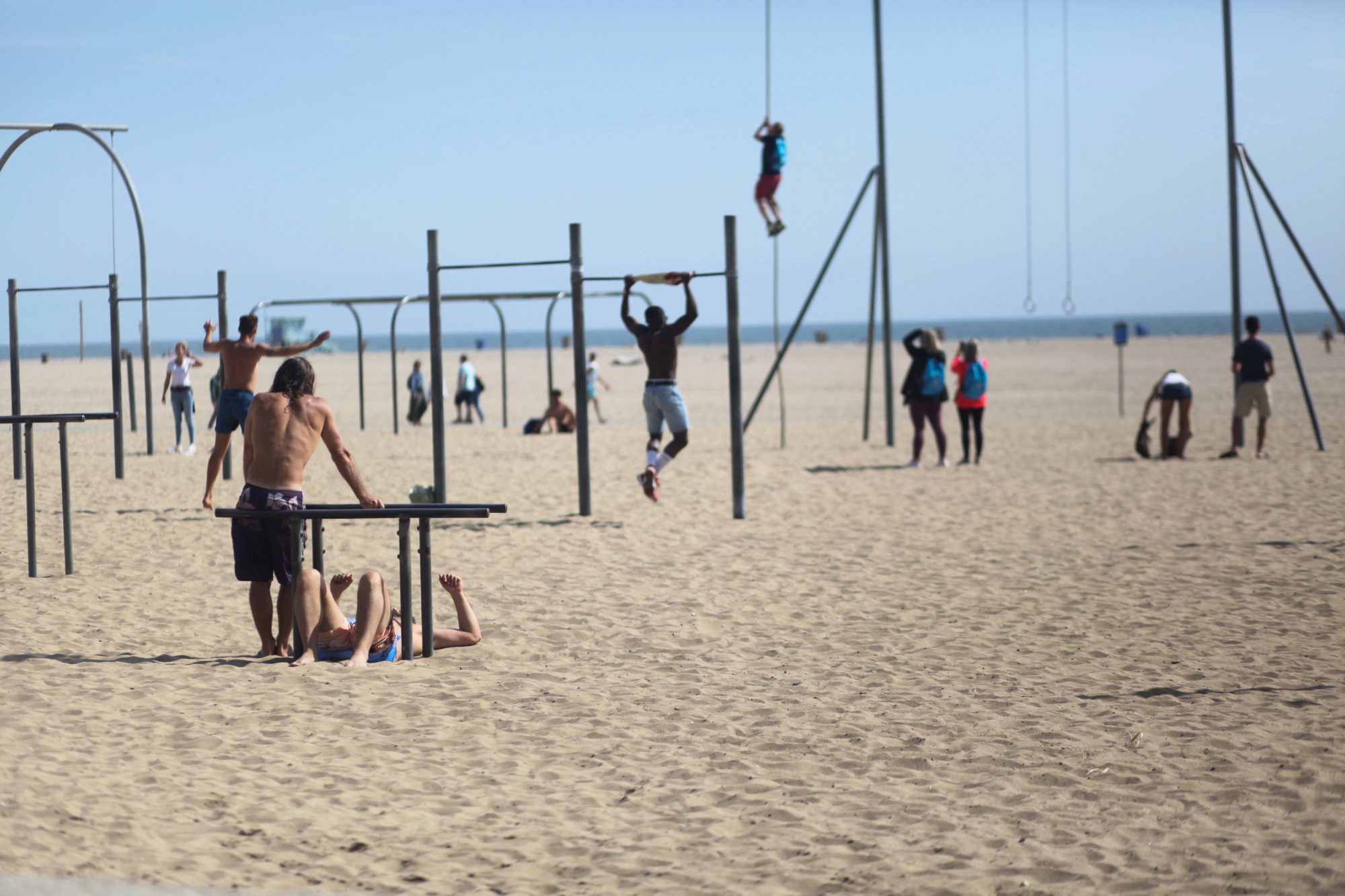 Photo of people working together on a beach