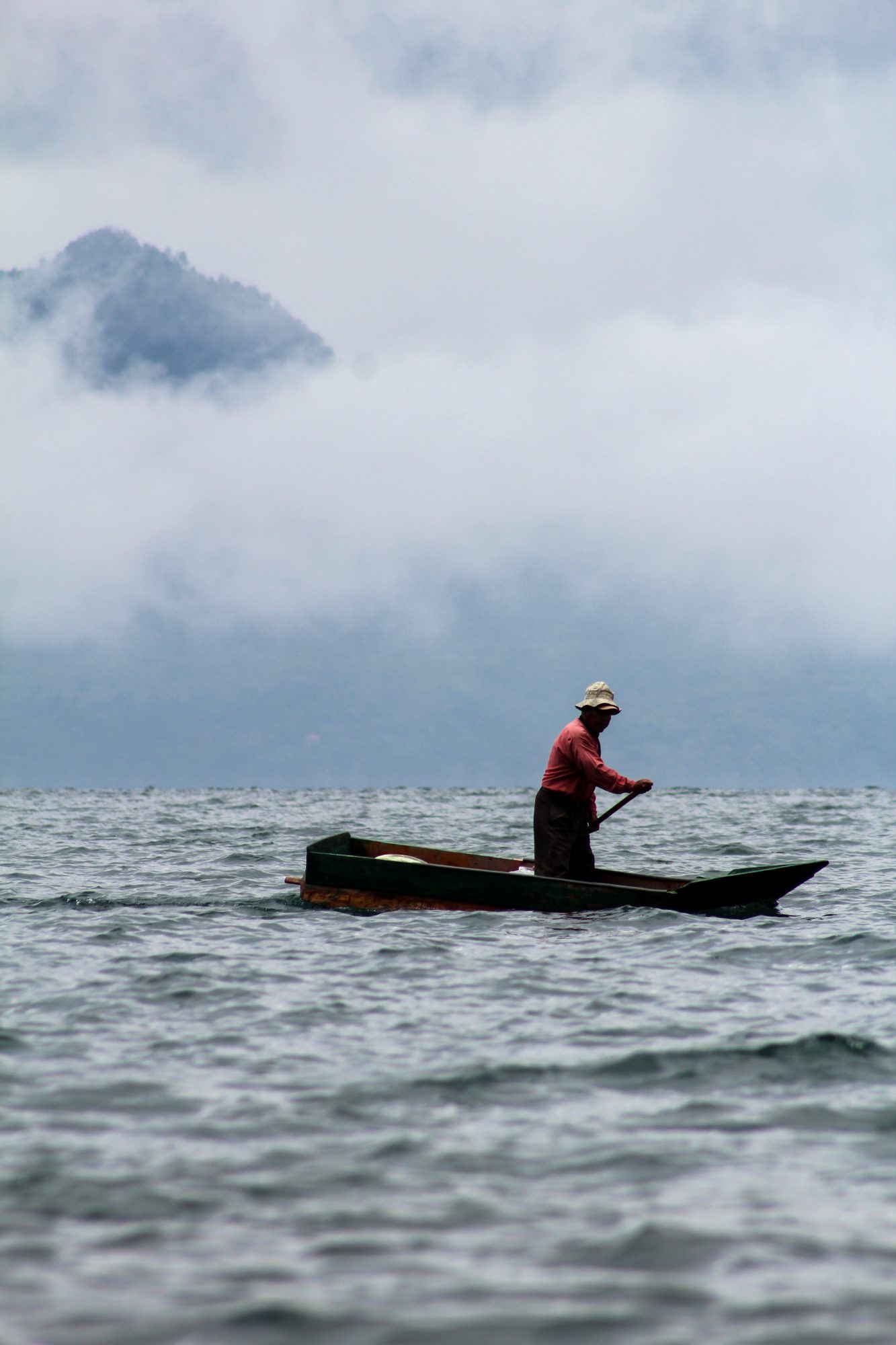 Photo of a person in a small fishing boat